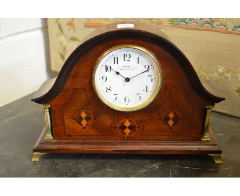 An inlaid mahogany dome topped mantle clock, the enamel dial signed Dyson clock maker to the King.