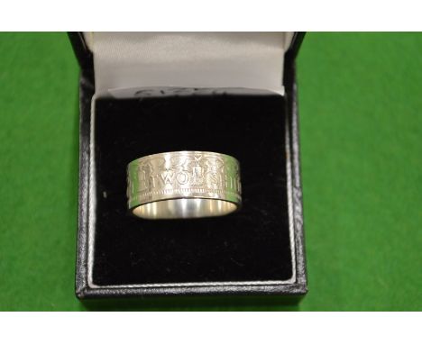 A 1954 coin ring size V.