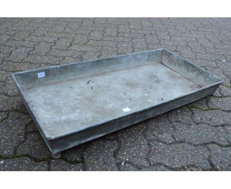 A rectangular galvanised trough or planter.