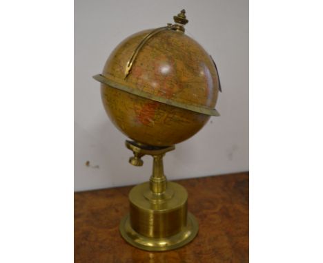 A good small rotating brass globe clock.