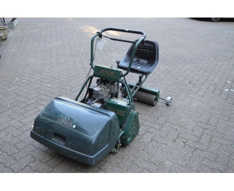 A good large Atco 24" cut petrol cylinder lawn mower complete with seat and roller.