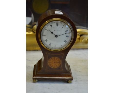 An Edwardian inlaid mahogany balloon shaped mantle clock, the enamel dial signed Harrods Ltd.