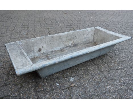 A galvanised rectangular planter/trough.