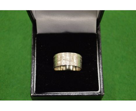 A 1954 one shilling coin ring size L ½.