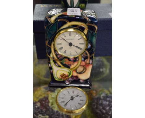 A Moorcroft mantle clock and a spare movement.