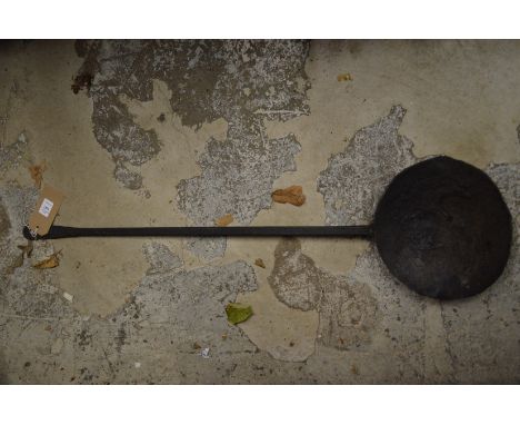 An old wrought iron ladle.