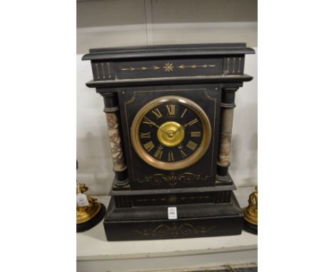 A large Victorian slate mantle clock.