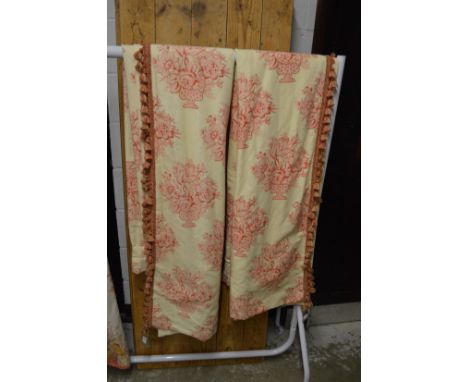 A pair of curtains, cream ground with stylised flower and vase decoration, each 210cm drop x 135cm at the heading.