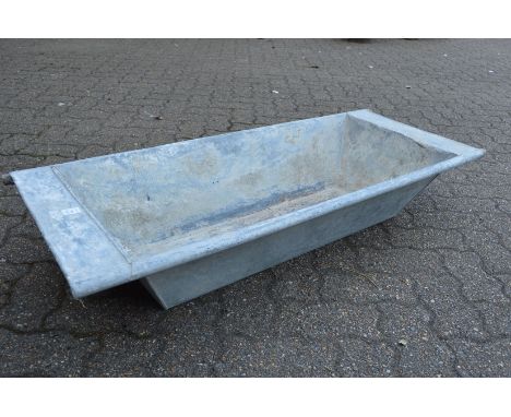A galvanised rectangular planter/trough.