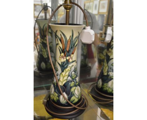 A large Moorcroft table lamp base with shade.