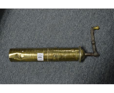 An Arabian brass coffee grinder.
