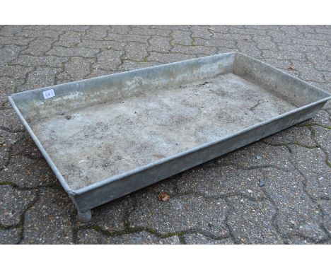 A rectangular galvanised trough or planter.