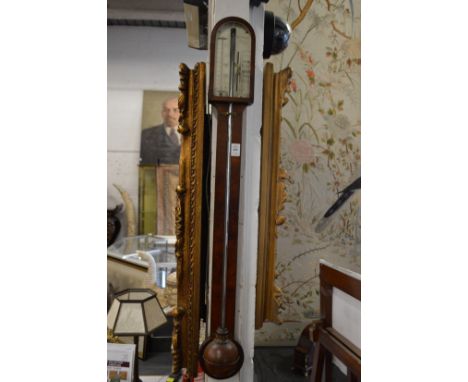 A George III mahogany stick barometer, the silvered dial signed Jas Lione, London.