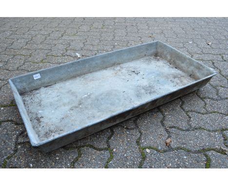 A rectangular galvanised trough or planter.