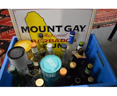 A Mount Gay pressed metal rum sign together with various part bottles of spirits and liqueurs etc (sold as seen).