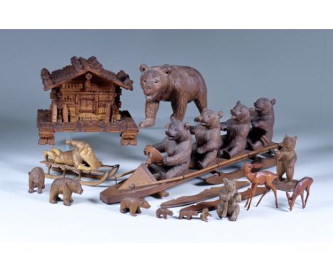 A Black Forest Carved Wood Model of Four Bears on a Sledge, Early 20th Century, 14.25ins x 4.25ins high, a similar model of a