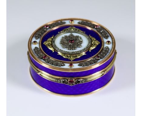 A Modern Two Coloured Gold Metal Enamel Diamond and Ruby Set Circular Box, the lid set with old cut diamonds and cabochon rub