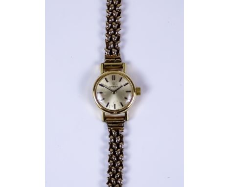 A Lady's Omega Manual Wind Wristwatch, plated case 18mm diameter, silver dial with gold baton numerals, on non-conforming 9ct