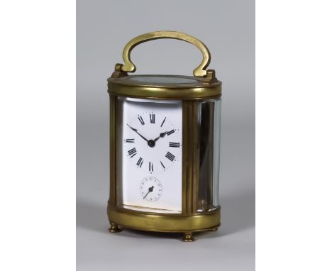 An Early 20th Century French Oval Carriage Clock with Alarm, the white enamel dial with Roman numerals and subsiuary seconds 