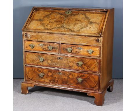 A Mid 18th Century Walnut and Oak Sided Bureau, the top and front inlaid with herringbone bandings, the top quarter veneered,