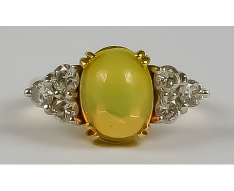 An Opal and Diamond Ring, Modern, 18ct yellow gold, set with centre cabochon opal approximately 10mm x 8mm, flanked by six br