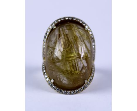 A Large Cabochon Gold Strand Rutilated Quartz Dress Ring, Modern, in 18ct gold mount set with rutilated quartz stone, 29mm x 