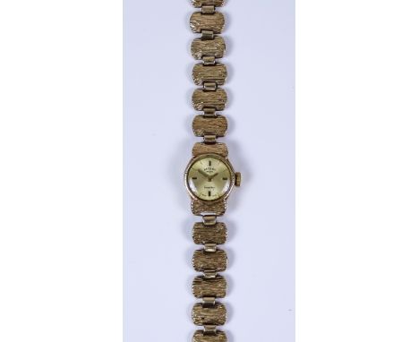 A Lady's Rotary Manual Wind Wristwatch, 9ct gold case, 14mm diameter case, with gold coloured face with gold baton numerals, 