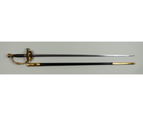 A French Naval Sword, Late 19th/Early 20th Century,  31ins double edge bright steel blade, brass guard and oyster decorated w