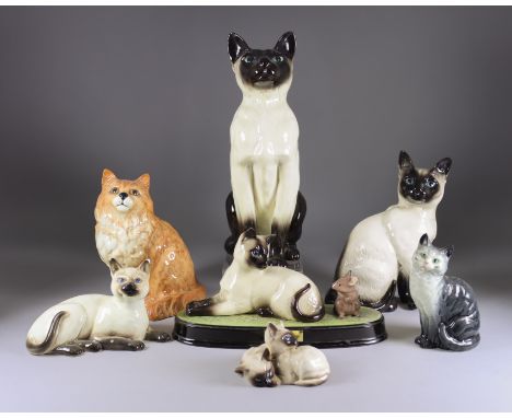 A Beswick Pottery 'Fireside Series' Seal Point Siamese Cat, model no. 2139, 13.75ins high, a model of a sitting ginger Persia