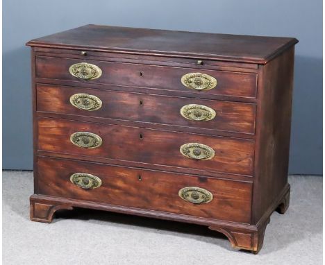 A George III Mahogany Chest, with moulded edge to top, fitted with a brushing slide and four long graduated drawers with gilt