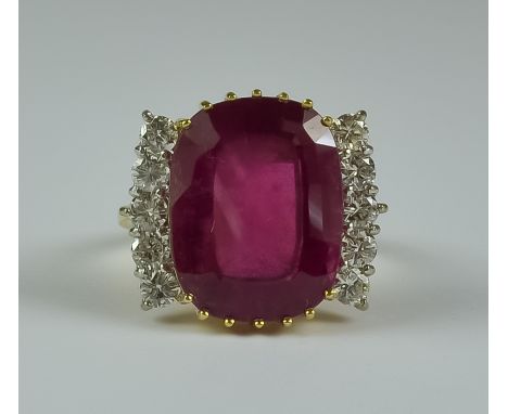 A Ruby and Diamond Ring, Modern, 18ct gold set with a centre ruby stone, approximately 5ct, flanked by ten brilliant cut roun