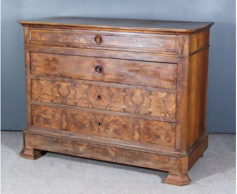 A 19th Century French Walnut and Figured Walnut Commode, with plain top, angled front corners, fitted four long drawers, the 