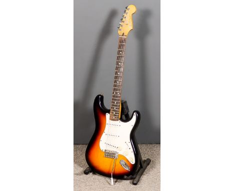 A Fender Stratocaster Electric Guitar, Serial No. MZ0011320, and black canvas bag for same