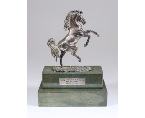 An Elizabeth II Cast Silver Model of a Rearing Horse - "Invicta", by Oclee &amp; Son, London 1977, mounted on green flecked m