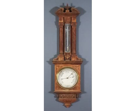 A Late Victorian Oak Aneroid Barometer and Thermometer, by Negretti &amp; Zambra of London, No. 29313, in oak case of archite