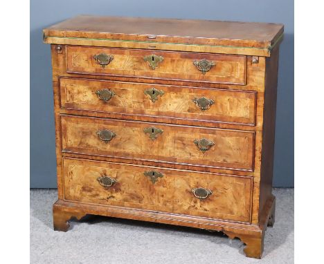 An 18th Century Walnut Bachelor's Chest, the baize lined folding top and drawer fronts inlaid with herringbone bandings and c