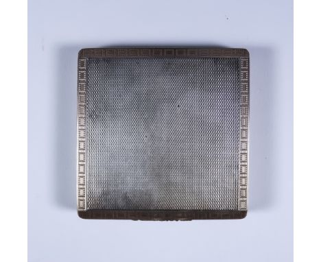 An Elizabeth II Silver and Silver Gilt Square Compact, by Cohen & Charles, London 1953, the whole with engine turned ornament