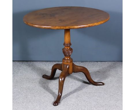 A George III Mahogany Circular Tripod Table, with plain top, on turned central column with wrythen knop, on cabriole legs, 28