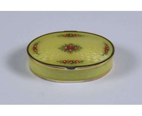 An Early 20th Century Continental Silver Gilt and Yellow Enamel Oval Box, stamped 925 standard, the lid and side with guilloc