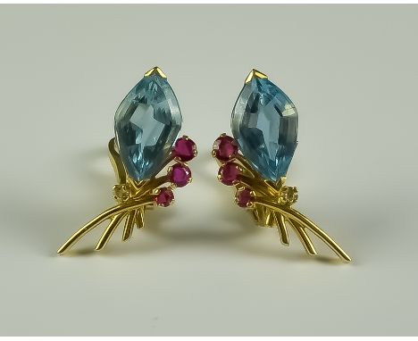 A Pair of Aquamarine and Ruby Earrings, clip on, 18ct gold, each set with an aquamarine stone of approximately 2ct flanked by