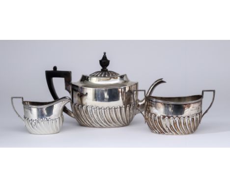 A Late Victorian Bachelors Silver Oval Three Piece Tea Set, by Harrison Brothers &amp; Howson, Sheffield 1889, with wrythen h