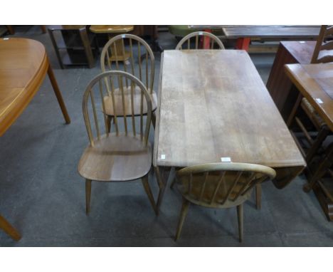 An Ercol Blonde elm and beech drop-leaf table and four Windsor chairs