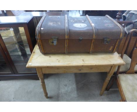 A pine kitchen table and a vintage steamer trunk 