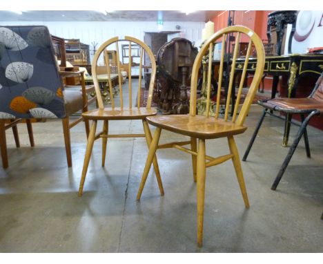 A pair of Ercol Blonde elm and beech Windsor chairs 