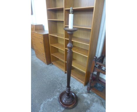 A carved mahogany standard lamp 