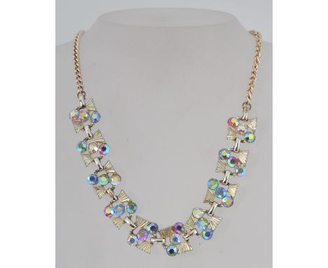 A vintage 1950s Aurora Borealis rhinestone prom  necklace with hook clasp and drop finial. Measures max 16 inches.