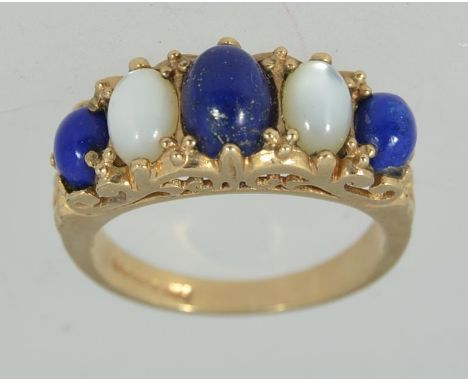 A vintage hallmarked London 9ct gold moonstone and lapis lazuli gypsy set dress ring, the stones of cabochon cut. Maker S&K T