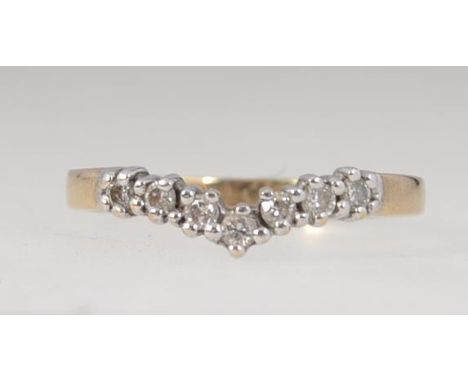 A vintage hallmarked Sheffield 9ct gold wishbone ring with 15pts channel set diamonds. Size K.5.