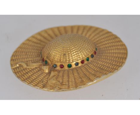 A large vintage yellow metal brooch pin in the form of a ladies sun hat set with green blue and red paste stones to ribbon wi