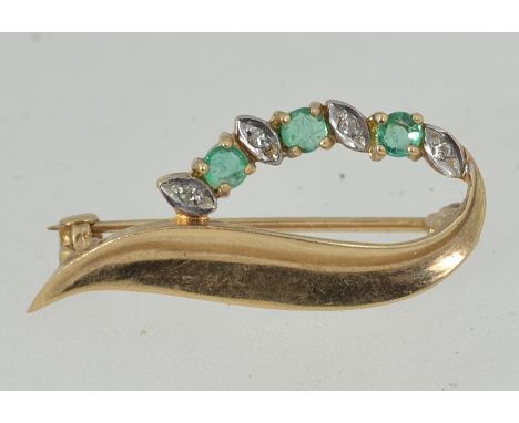 A  vintage 9ct gold hallmarked Art Nouveau style leaf brooch set with emeralds and diamonds with good roller clip clasp. Hall